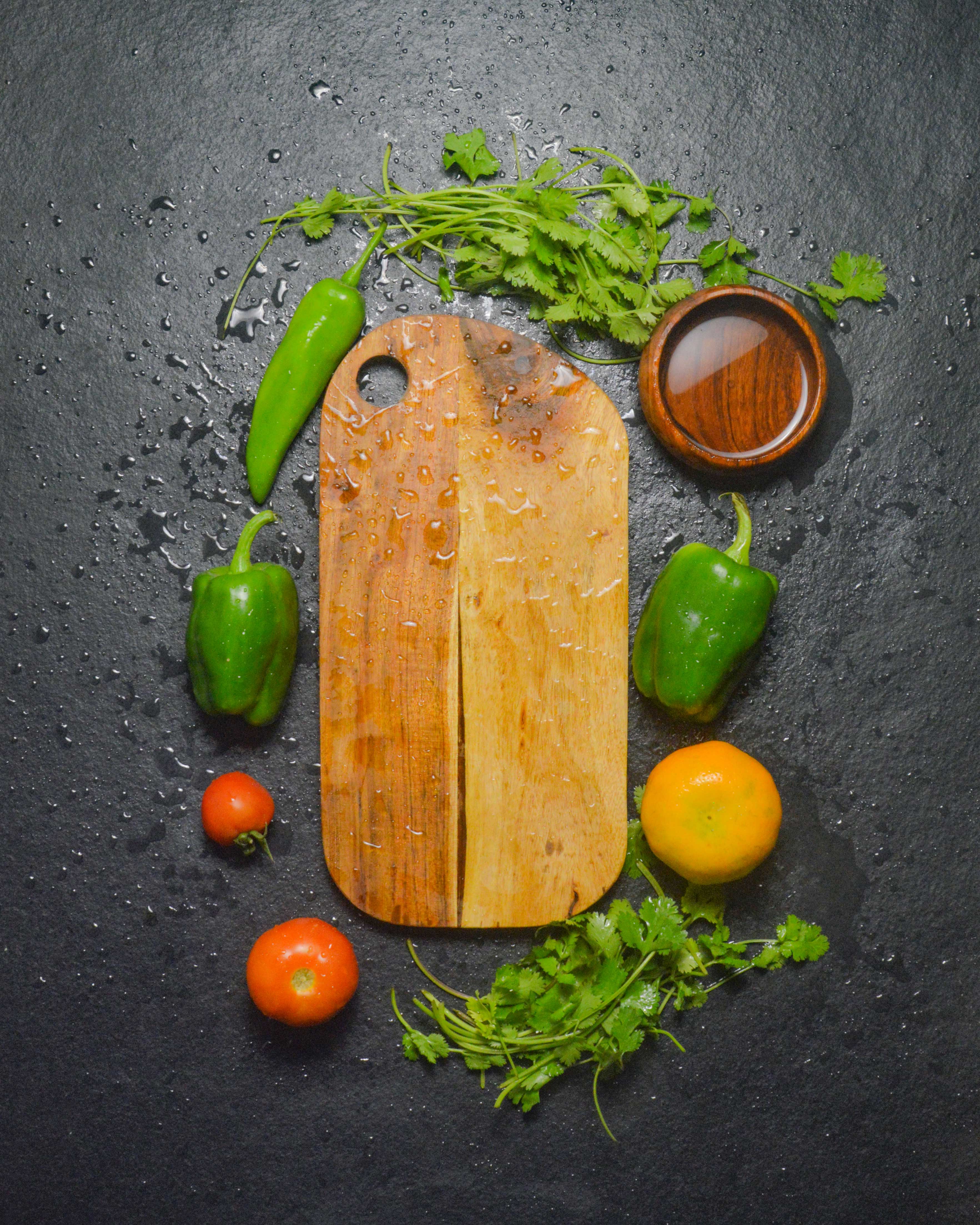 Artisan wooden chopping board 35x7.5 cm with fresh vegetables and herbs - sustainable kitchen cutting board