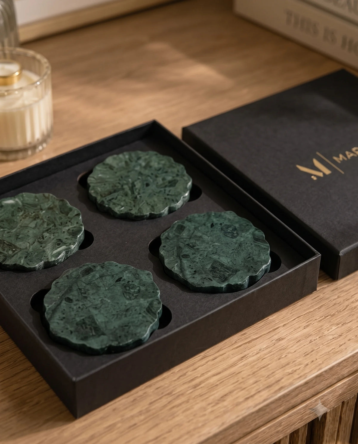 Green scalloped coasters shown in a table setting with drinkware.