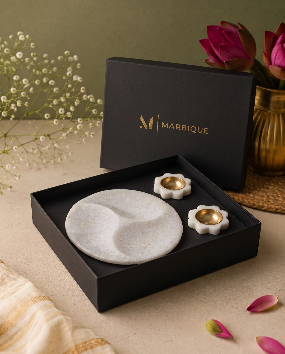 Round white tray with three curved sections and two floral gold-tone-cup holders in a black Marbique box.
