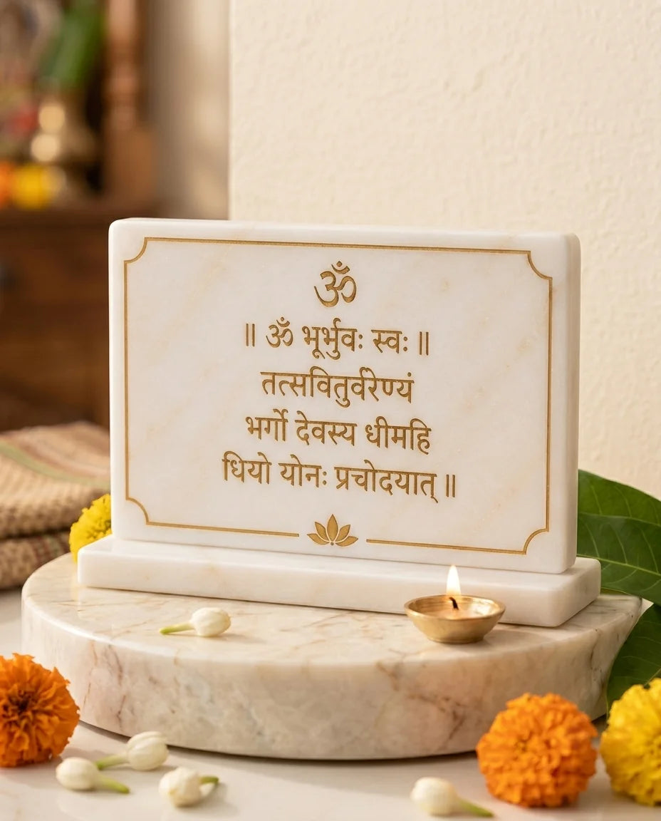 White Gayatri Mantra plaque with gold-tone Devanagari lettering, Om and lotus motifs, pictured upright on a rectangular base.