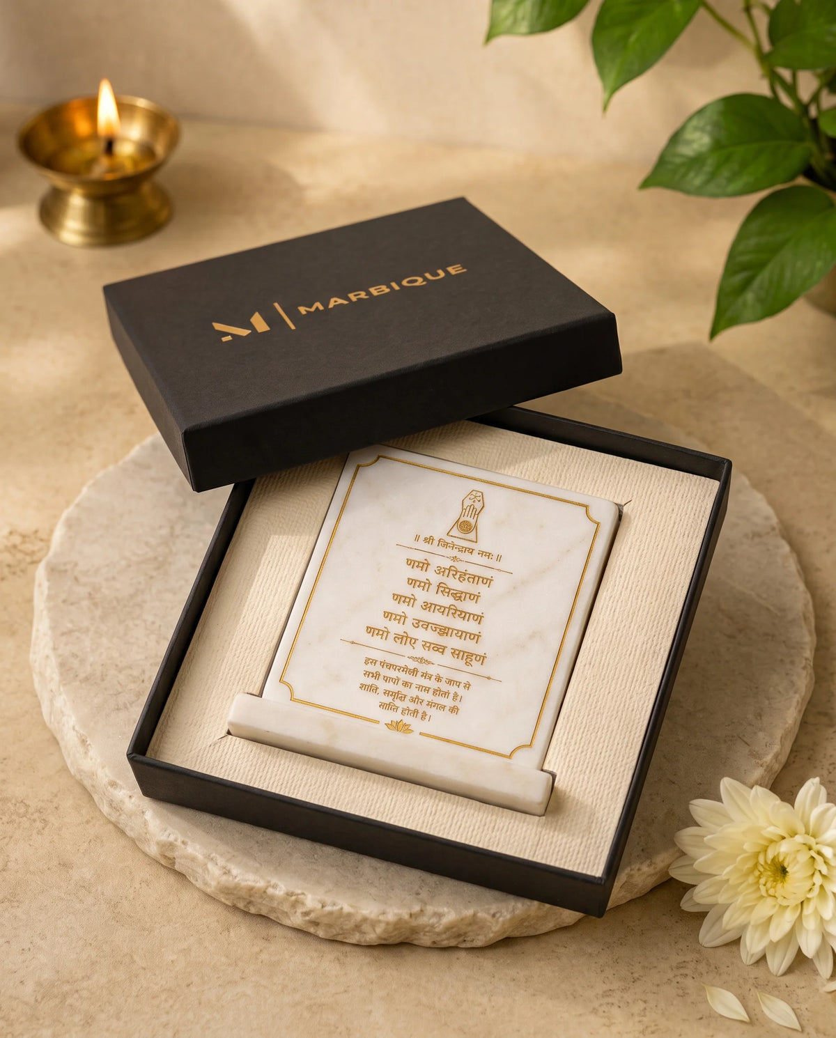 Front view of the white Namokar Mantra plaque with fine gold-tone border and lotus detail.