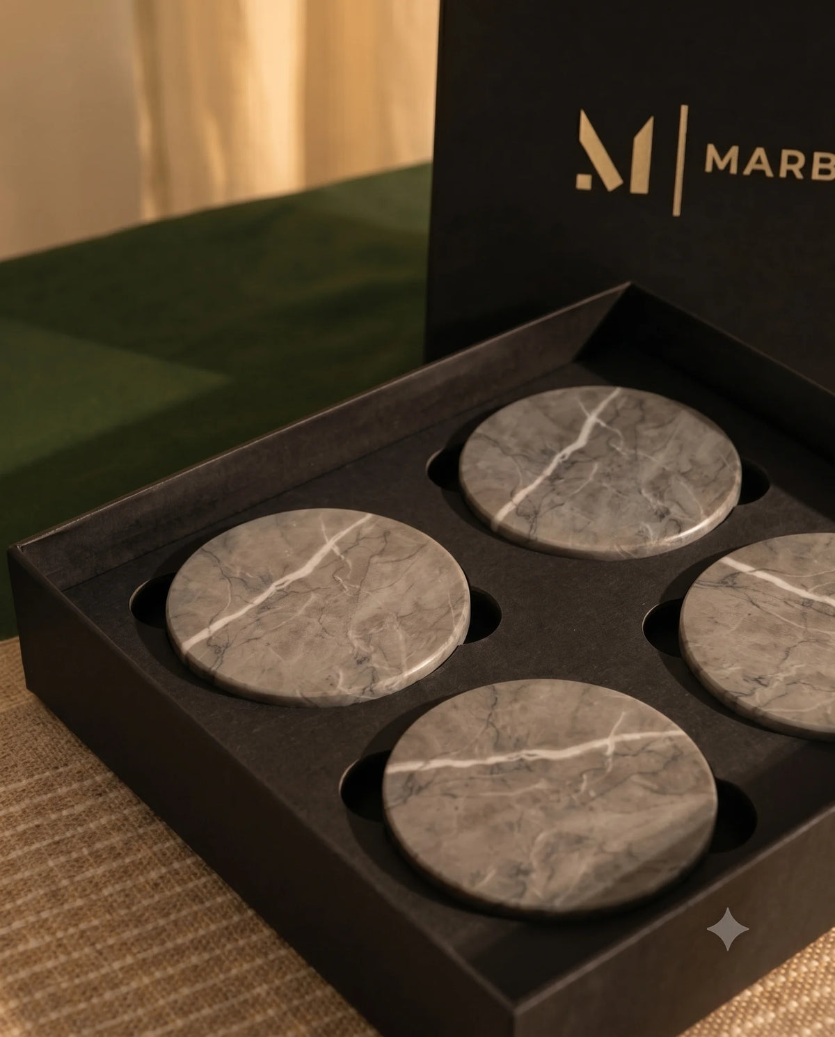Grey circular coaster design with pale branching veins on the surface.