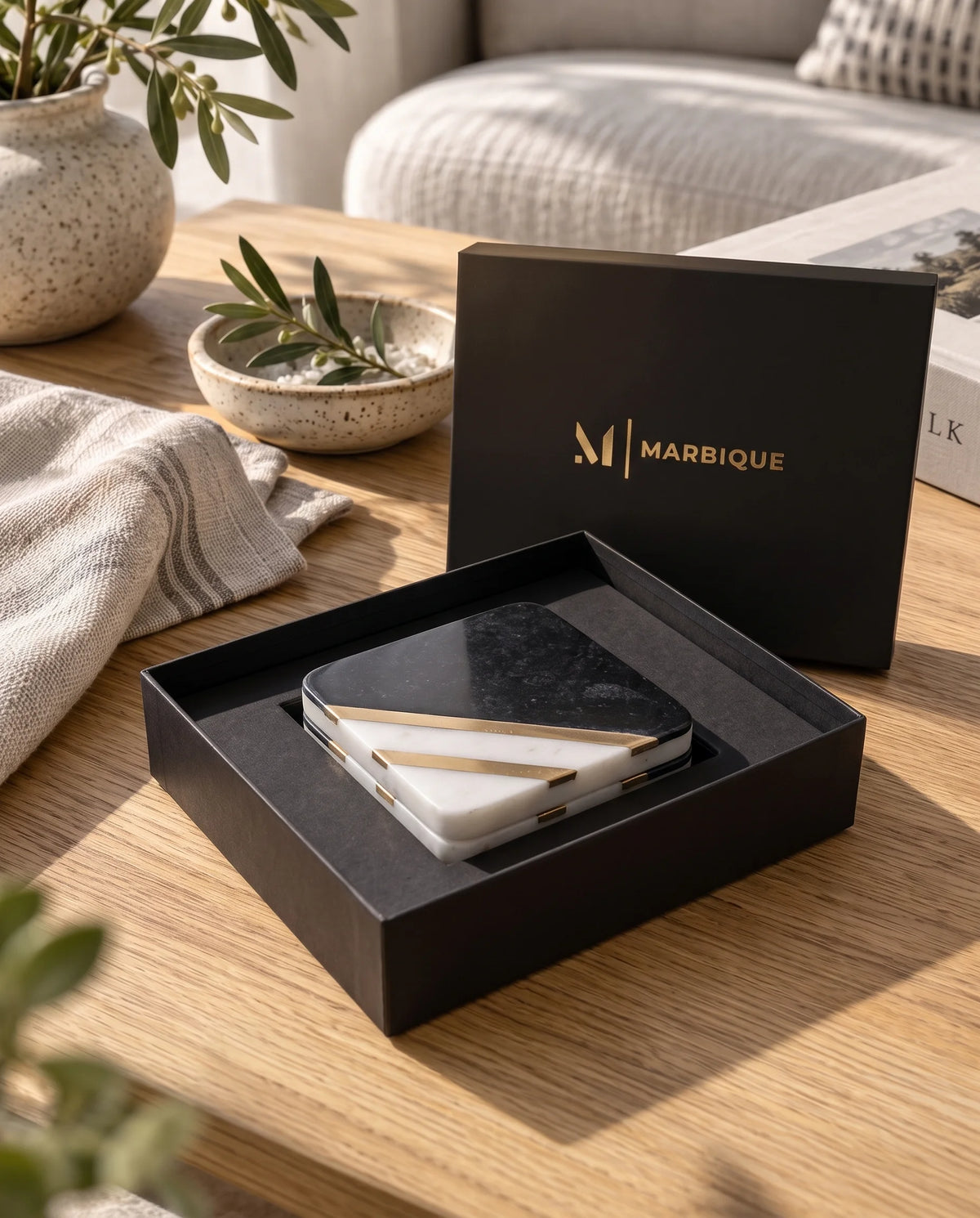 Square coaster design with a dark speckled section, white corner and diagonal gold-tone bands.