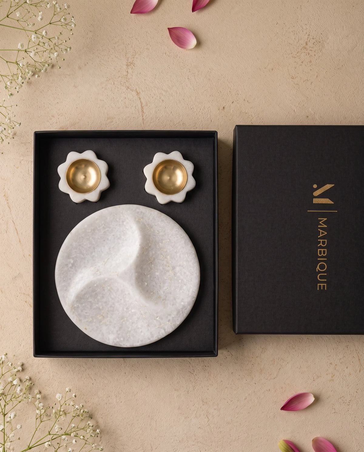 White three-section tray and floral holders styled in their box within a home display.