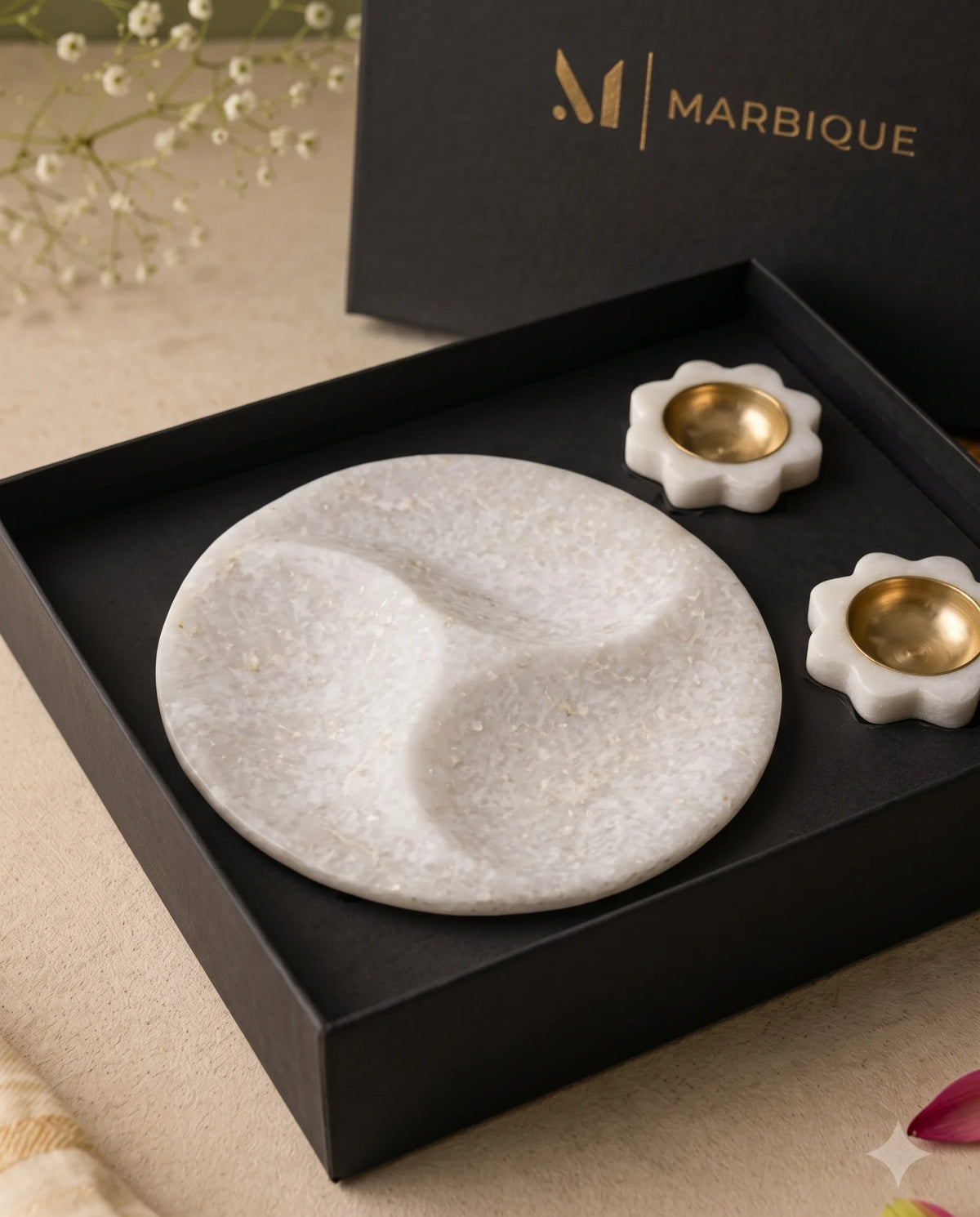 Close view of the curved tray sections and white floral holders with round gold-tone cups.