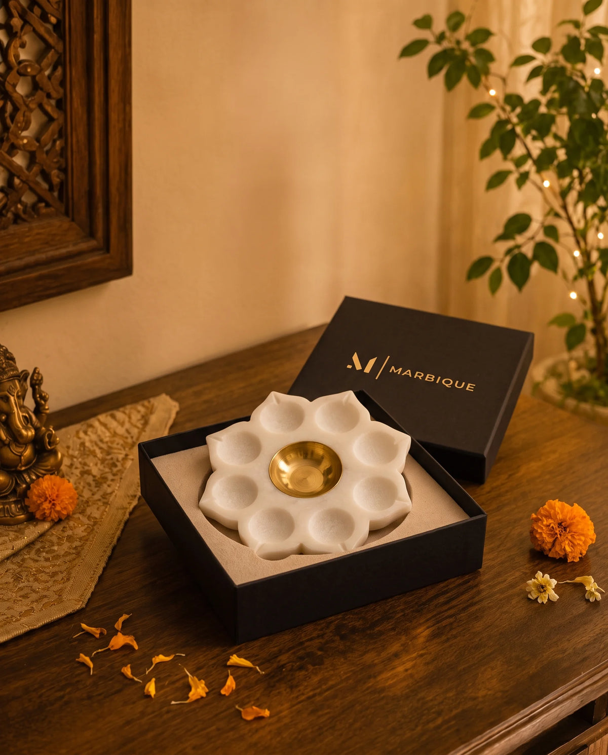 Close view of white petal-shaped recesses surrounding a round gold-tone central cup.
