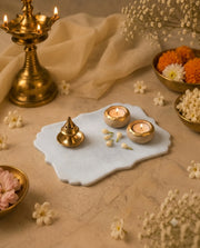 Close view of the pale tray surface and ornamental curved edge details.