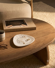White rounded triangle tray styled as a tabletop accessory.