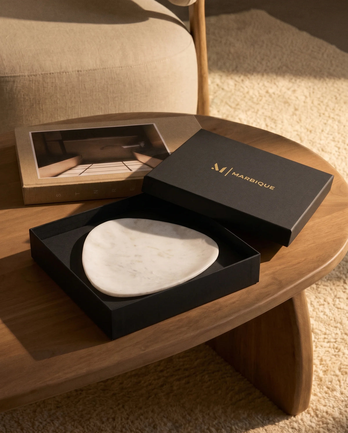 Close view of the pale surface and broad curved edge of a white triangular tray.
