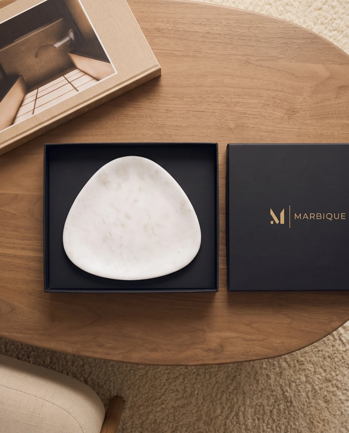 Angled view of the white tray with its rounded triangular outline.