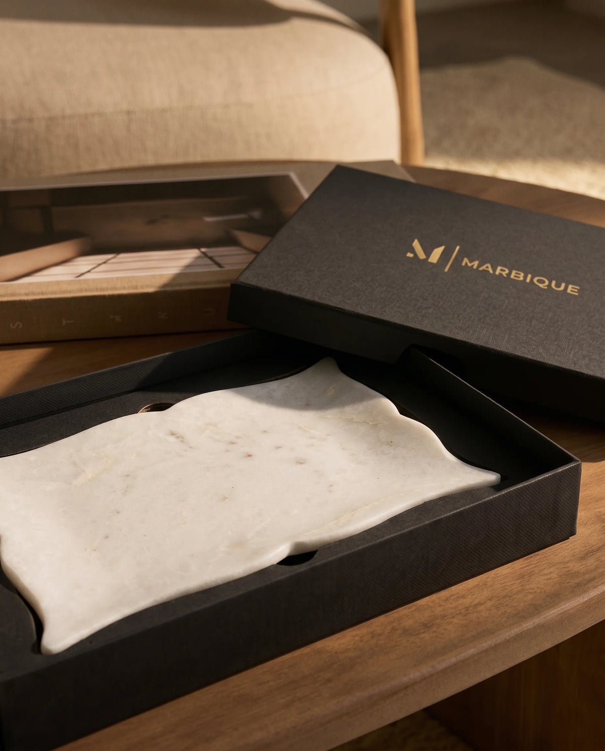 White rectangular tray showing curved scalloped sides and pointed corner details.