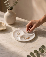 White circular tray showing three sweeping dividers meeting near the centre.