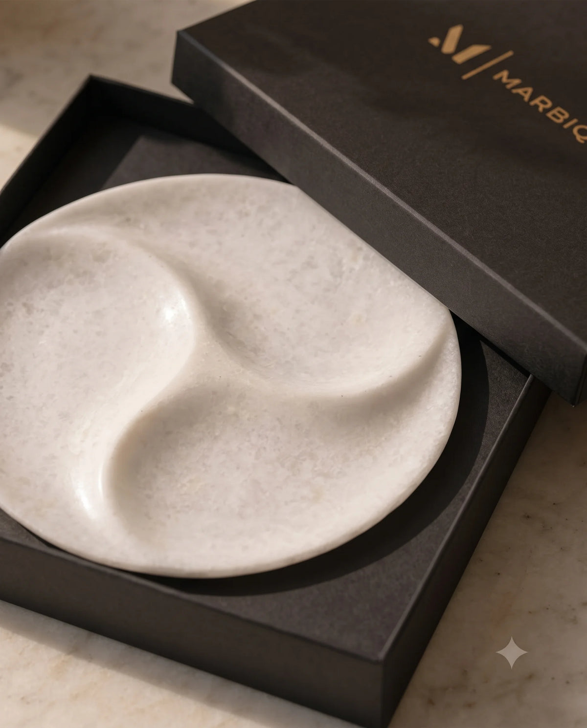 White three-section circular tray displayed with black Marbique packaging.
