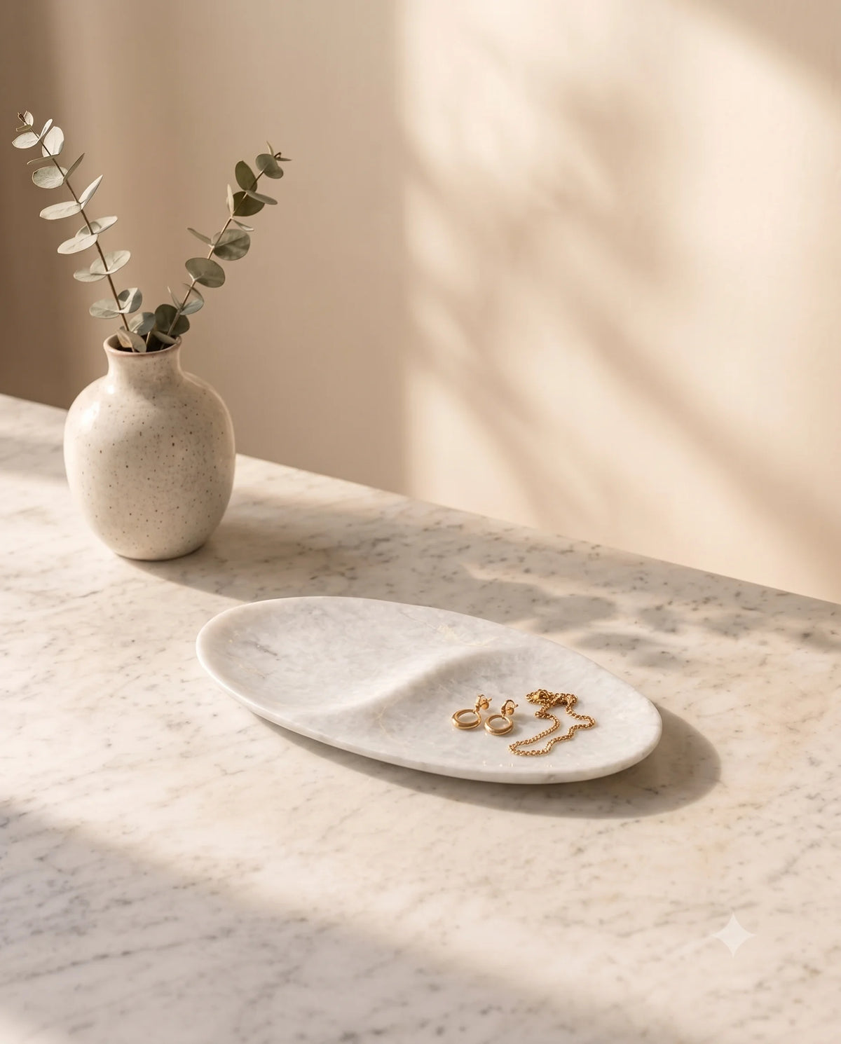 White oval tray showing two recessed sections and its central raised divider.