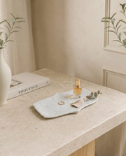 White curved-side decorative tray displayed with Marbique presentation packaging.