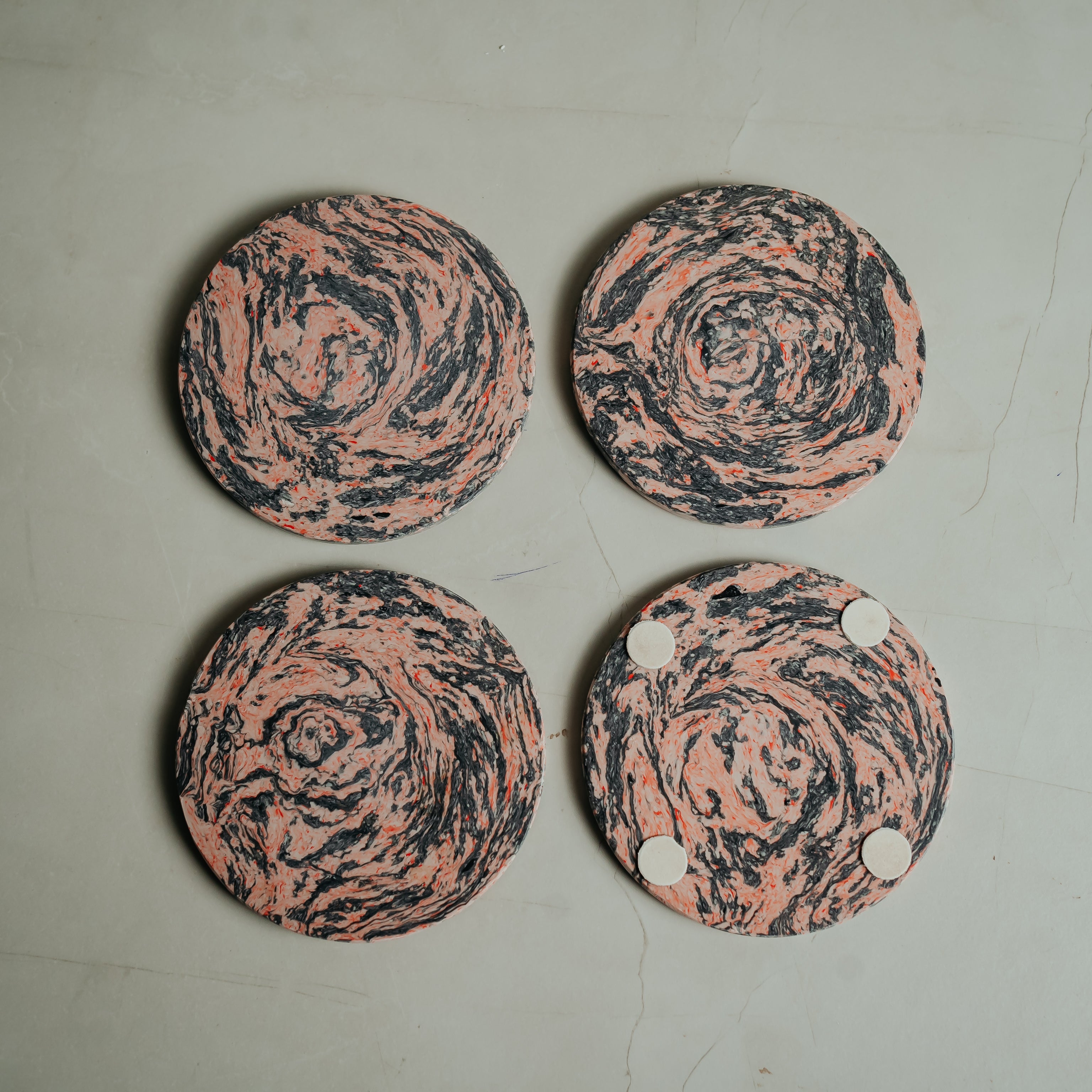 Set of 4 marble resin coasters with coral and cream stone patterns