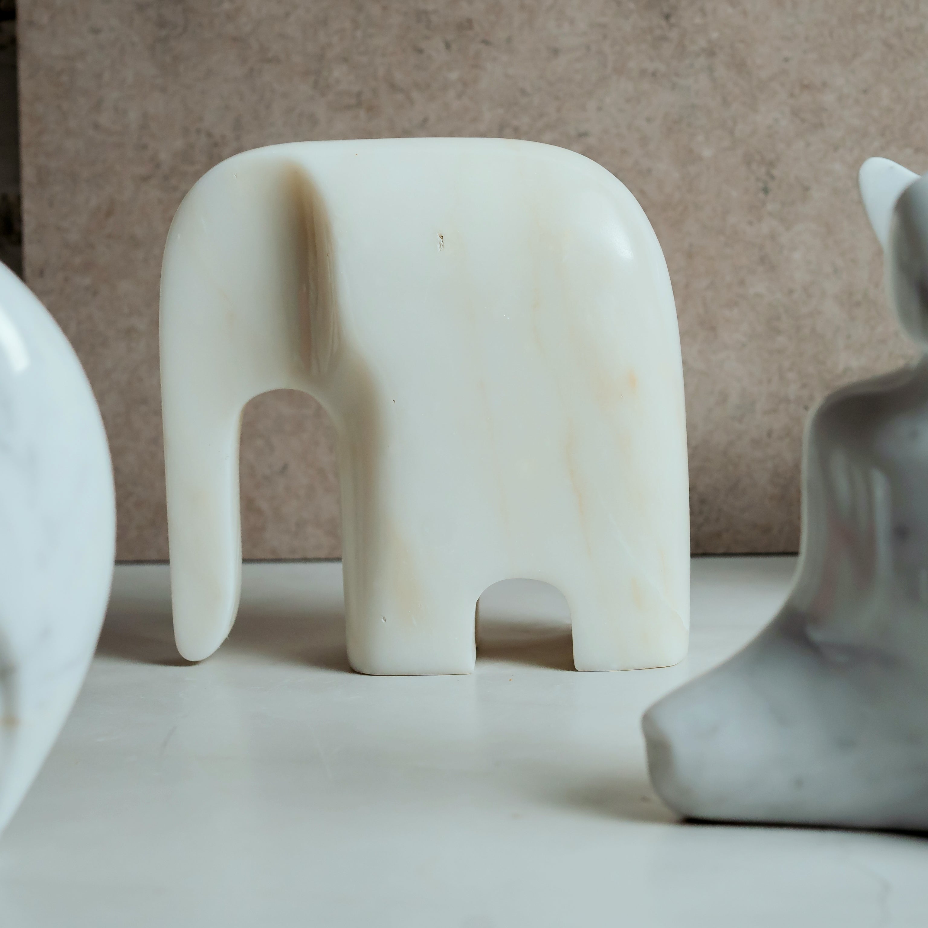 Elegant hand-carved marble elephant statue - decorative white marble sculpture for home and office