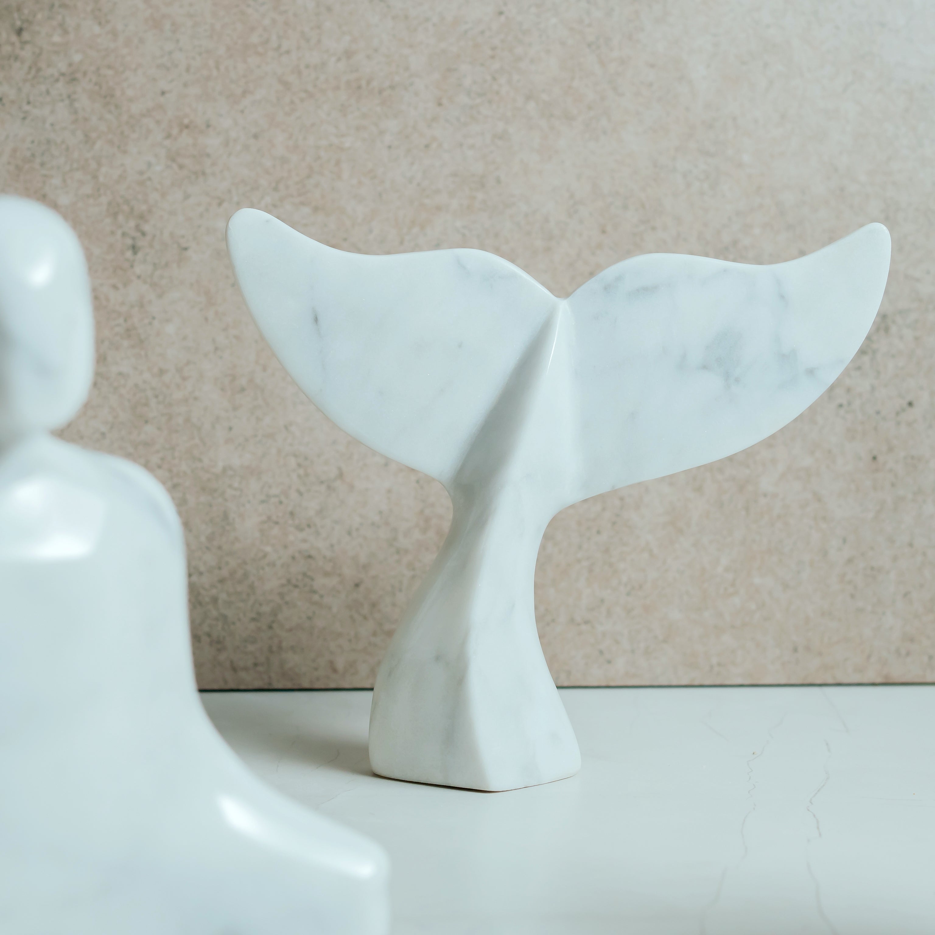 Elegant marble fish sculpture side view - hand-carved white marble aquatic art piece